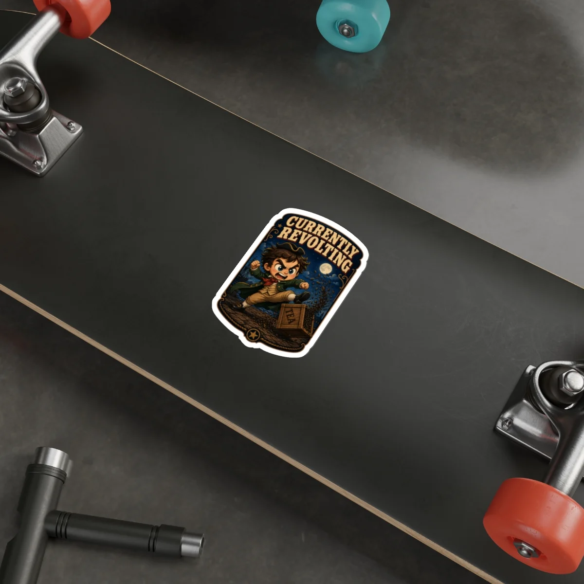 Currently Revolting sticker displayed on a black skateboard deck