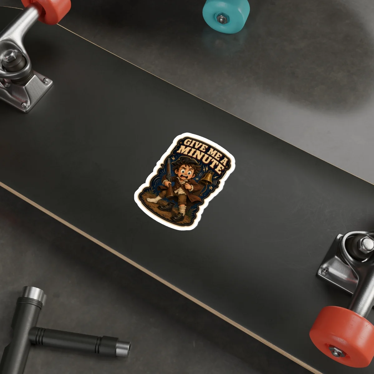 Give Me a Minute sticker displayed on a black skateboard deck